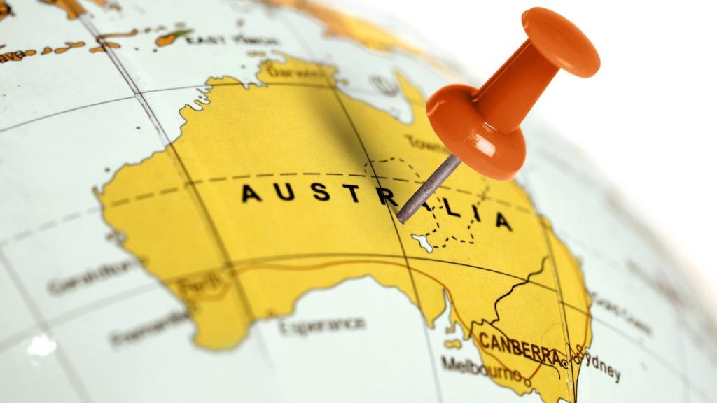 Map of Australia with orange pushpin marking a location, illustrating Australian migration and workforce mobility.